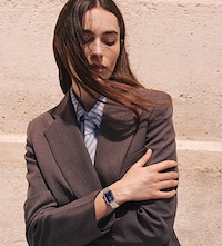 Female model wearing Tissot watch. Tap to shop ladies watches image