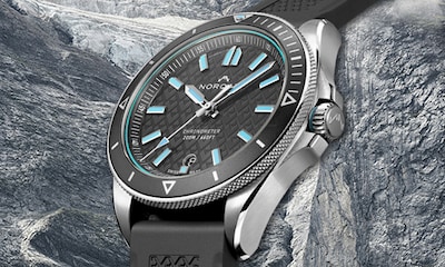 Norqain watch with charcoal dial and strap with blue accents. Tap to shop Adventure Sport collection image