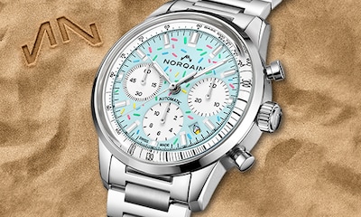 Norqain watch with baby blue dial and confetti accents. Tap to shop Freedom collection image