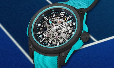 Norqain watch with black and blue strap and dial and skeleton accents. Tap to shop Independence collection image