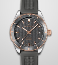 Ladies Norqain watch with grey dial and strap and rose rold accents. Tap to shop ladies norqain watche image
