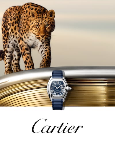 Cartier Roadster watch with Leopard in the background with Cartier logo image
