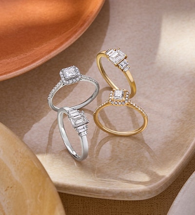 image of diamond engagement rings in ceramic bowl - tap to shop all engagement rings image