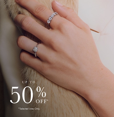 Image of female model wearing engagement rings - up to 50% off selected lines - shop now image