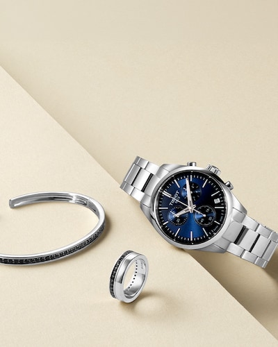 Image of Tissot watch, and mens jewellery for Fathers Day campaign. Tap to shop all image