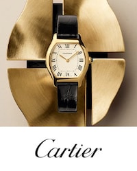 Cartier Tortue with black strap on metal background. Tap to shop New Cartier watches for Watches & Wonders 2026 image