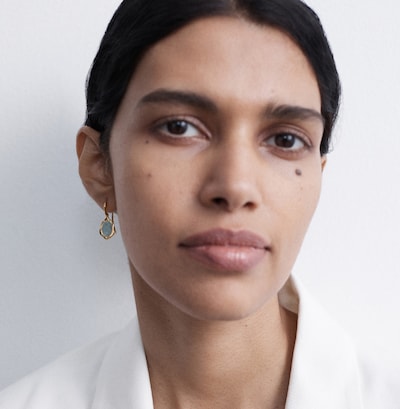 Image of a woman wearing Monica Vinader Odssey collection earrings image