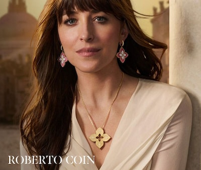 Image of Dakota Johnson wearing Roberto Coin jewellery in campaign. Tap to shop image