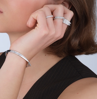 Repossi campaign showing model wearing Repossi rings and bracelet image