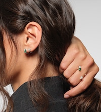 Repossi earrings and rings on female model Tap to shop Repossi jewellery image