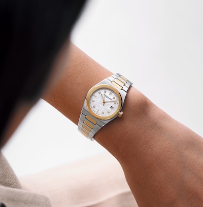 Image of ladies' hand wearing Raymond Weil bi-colour dial watch image
