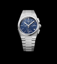 Tissot Watch with blue dial on black background. Tap to Shop New Arrivals image