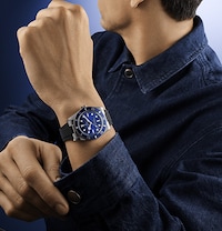 Male model wearing Tudor black bay watch. Tap to shop all tudor watches image