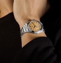 Model wearing new Tudor watch. Tap to shop all new Tudor watches image