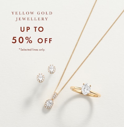 Image of yellow gold bracelet, earrings and ring on cream background. Up to 50% off yellow gold jewellery. Selected lines only, image