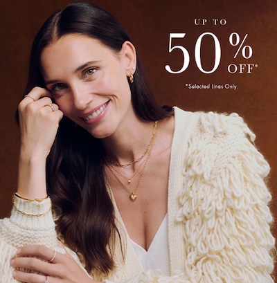 Image of female model wearing yellow gold jewellery - up to 50% off selected lines - shop now image